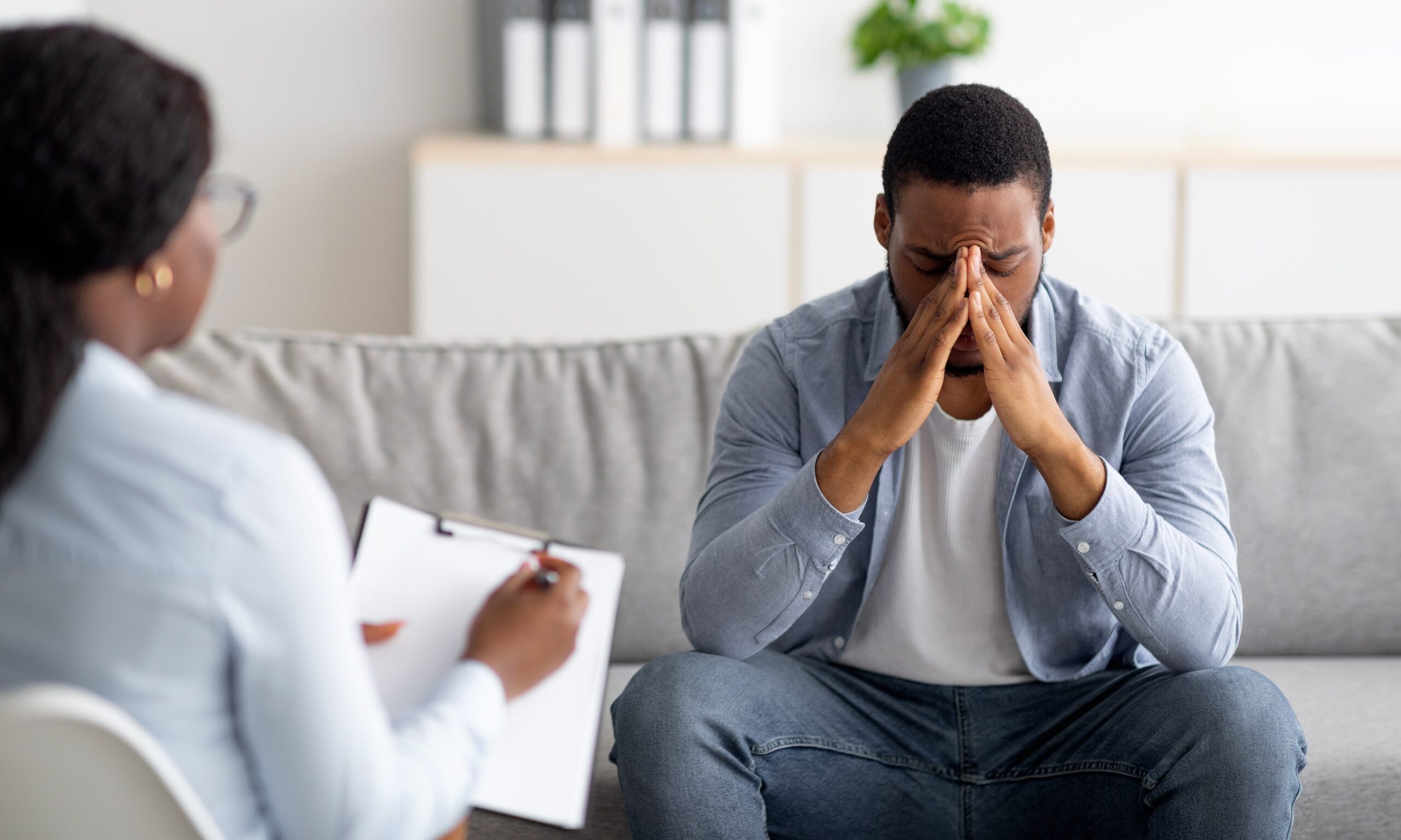 man in therapy for emotional trauma