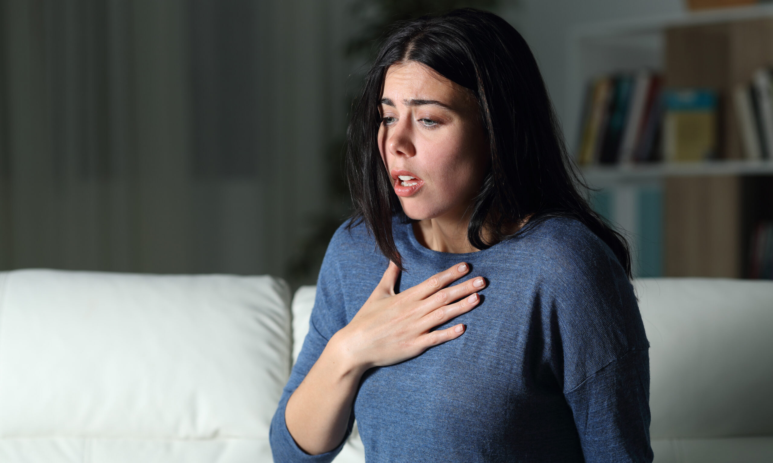 woman experiencing physical symptoms of anxiety